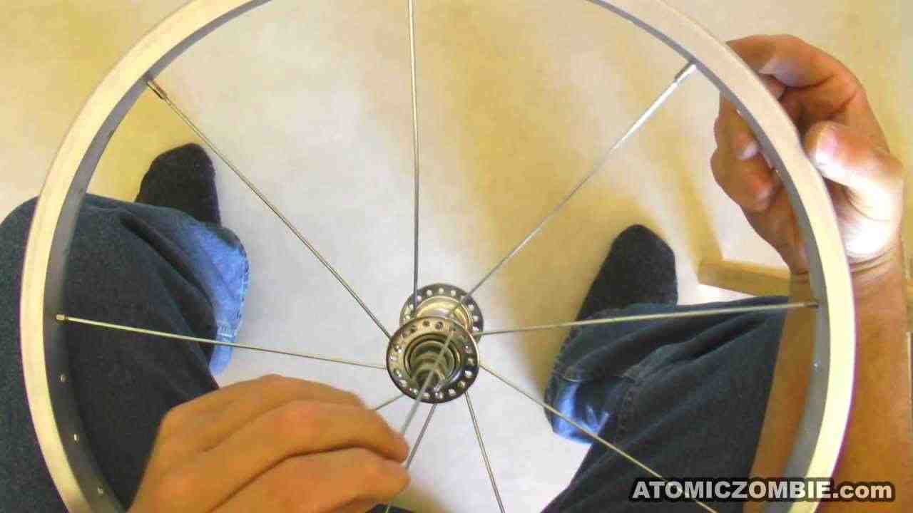 How do you put new spokes on a bike wheel?